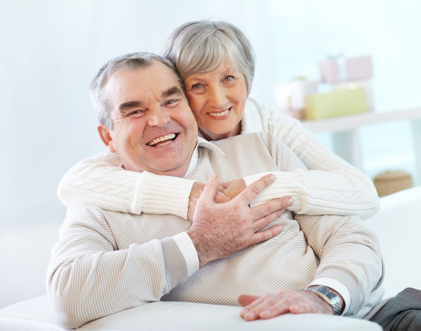 senior-couple-hugging-home